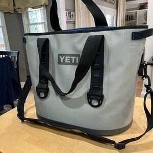 Yeti Light Gray Cooler Tote with Black Straps and Blue Trim